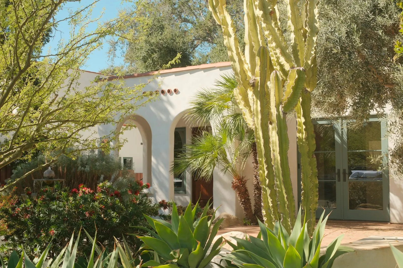 Spanish-style home with desert landscaping out front